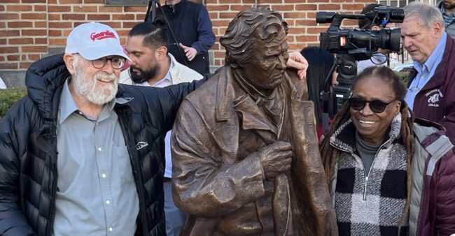 CJ & Mike next to a Statue